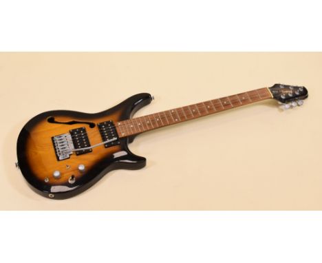 A TANGLEWOOD TOMKAT ELECTRIC GUITAR in light and dark contrast wood, 90cms long