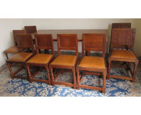 Robert Mouseman Thompson of Kilburn - an oak rectangular dining table, adzed rectangular top on octagonal and block supports 