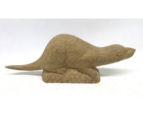 Peter Raymond Stout - a carved oak model of an Otter, on tooled rounded rectangular base, with PRS signature and Fri. Sat. 10