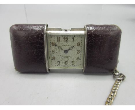 Movado Ermeto ladies silver purse watch on plated chain, leather trimmed sliding outer case, signed silvered Arabic dial, cas