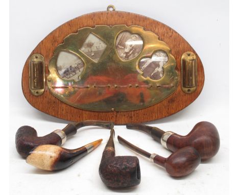 20th Century Arts and Crafts oak wall mounted pipe rack, central oval brass pipe holder with four playing card apertures set 
