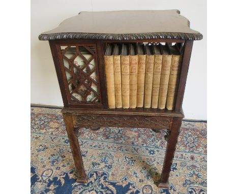 Edwardian mahogany Chippendale Revival revolving bookcase, serpentine square carved top and blind fret frieze on square suppo