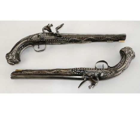 Elaborate pair of 18th/19th century Turkish 16 bore flintlock holster pistols, 11" barrels with traces of engraving to the to