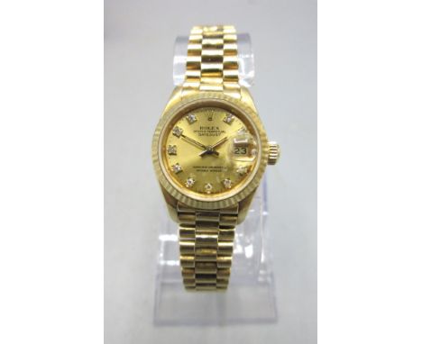 Ladies Rolex Oyster Perpetual Datejust 18ct gold automatic wristwatch with date on matching Jubilee bracelet with signed depl