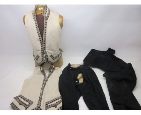 Carlton Towers - two early/mid 19th century Butler's Livery, felt waistcoat with embroidered border, metal buttons with embos