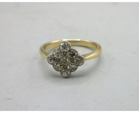 Art Deco nine stone cluster ring set with three rows of three brilliant cut diamonds, in rub over setting, stamped 18ct, size