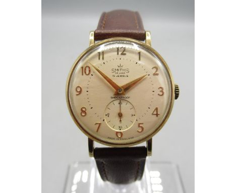 Smiths De Luxe 9ct gold Morris Motors Ltd. presentation wristwatch on brown leather strap, signed champagne Arabic dial with 