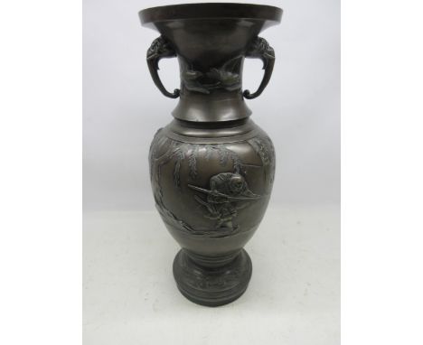Large Japanese Meiji period bronze vase, baluster body relief decorated with figure on a bridge, trumpet neck with elephant h