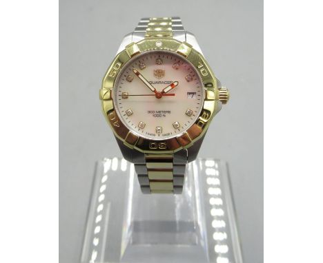 Tag Heuer 300m Aquaracer, Ladies stainless steel and gold plated quartz wristwatch with date on matching bracelet with signed