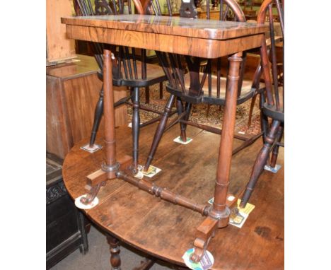 An early Victorian rosewood side table, mid 19th century, of rectangular form with a plain frieze, on tapering supports with 