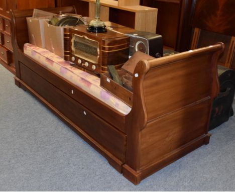 A single mahogany sleigh bed with pull out second bed, two mattresses