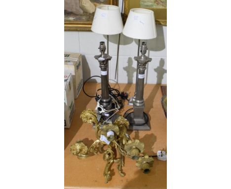 A pair of Laura Ashley silvered column table lamps, another pair of modern table lamps, a pair of cast gilt metal three light