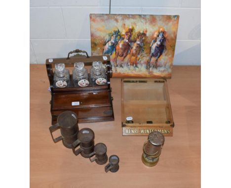 A modern tantalus, measures Wintermans display case, miners lamp and an oil of racehorses, signed Sanforit 