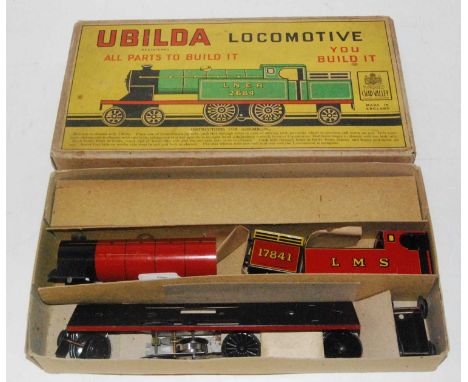 A Chad Valley Ubilda locomotive housed in the original labelled card box, appears complete with various sealed packets, and a