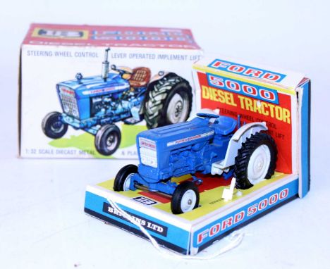 A Britains No. 9527 Ford 5000 diesel tractor, comprising of blue body with grey mudguards and grey hubs, complete with exhaus