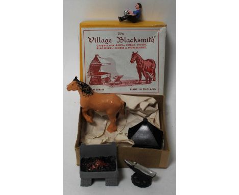 An FG Taylor &amp; Sons Ltd model No. 169 The Village Blacksmith gift set, comprising of anvil, forge, hood, blacksmith horse