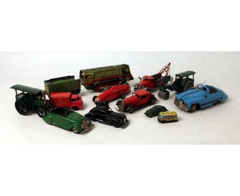 One tray containing a quantity of mainly Triang Minic and other tinplate and clockwork vehicles and accessories to include a 
