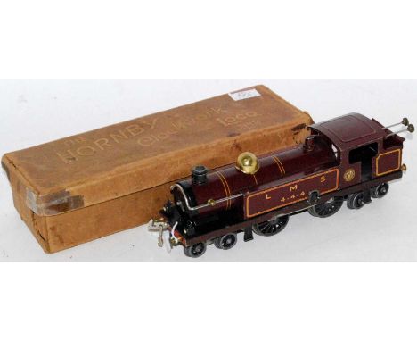 A Hornby clockwork No. 2 4-4-4 tank engine, minor damage for age, usual paint loss around keyhole LMS red fully lined livery,
