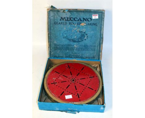 Meccano geared roller bearing, late 1930s red and gold, well used, with (BP)