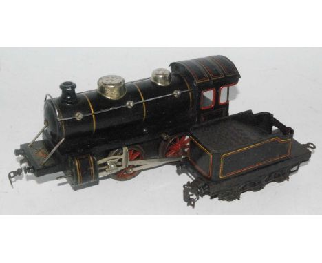 A continental outline 0-4-0 engine and tender lined black, manufacturers red/gold label Fandor JK Co (N), c/w powered but no 