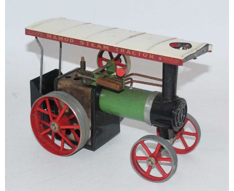 A Mamod steam tractor, would benefit from cleaning, appears to have been steamed corrosion spots to canopy roof, and sold wit
