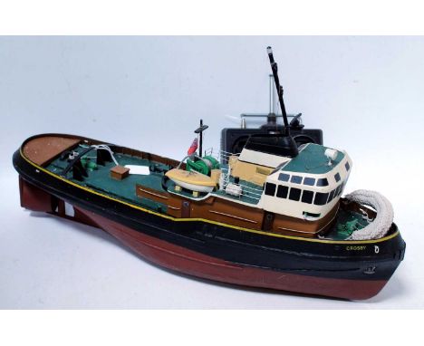 A wooden kit built, possibly Calder Craft, model of a Liverpool Crosby tug, finished in red and black with a yellow lining an