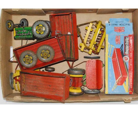 A collection of various Mettoy and similar tinplate farming  vehicles and accessories to include a boxed Mettoy tractor &amp;