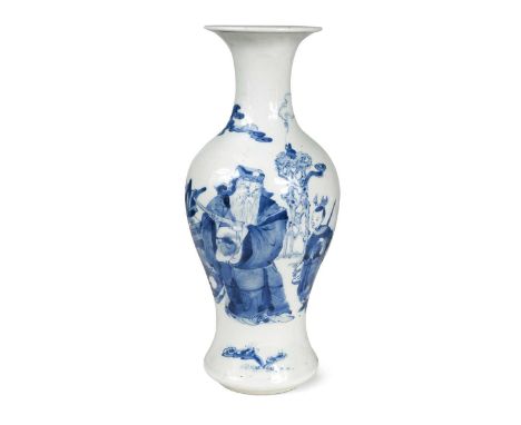 A Chinese blue and white porcelain baluster vase, Qing Dynasty, 19th century, painted with a scholar and attendant, four char