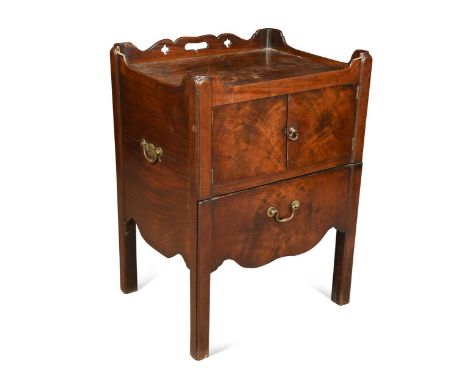 A George III mahogany bedside commode, the tray top over a pair of cupboard doors with commode drawer below raised on square 