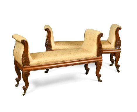 A pair of Victorian rosewood yellow upholstered window seats, with lyre scrolled ends, on cabriole legs and brass castors62 x