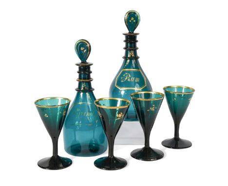 A pair of Regency green glass triple neck decanters,  inscribed in gilt Brandy and Rum, within bottle ticket style cartouches