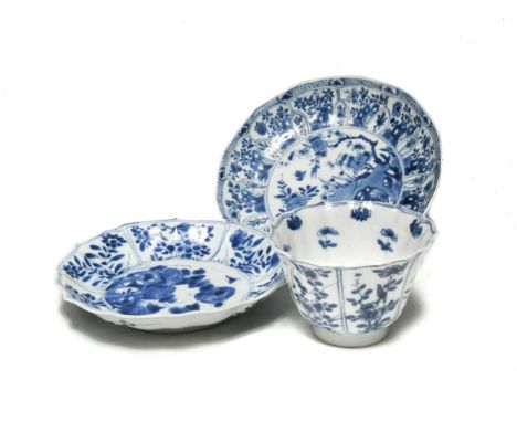 A Chinese blue and white barbed-shaped dish, Kangxi (1662-1722), decorated with birds, blossoms and insects in a rock garden1