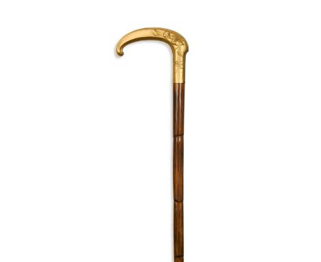 A French gilt metal Art Nouveau walking stick, circa 1890, with a palm wood shaft and metal tip, small stamped mark and fix91