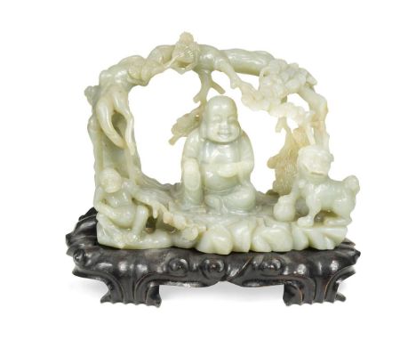 A Chinese jade-type carving of a Buddha, monkey and lion, beneath a pine tree arch, on a wooden stand19 x 24 x 14cmSmall bran