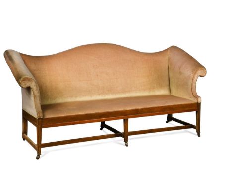 An Edwardian mahogany camel back sofa, the shaped back with outscrolled arms raised on tapered legs united by stretchers101 x