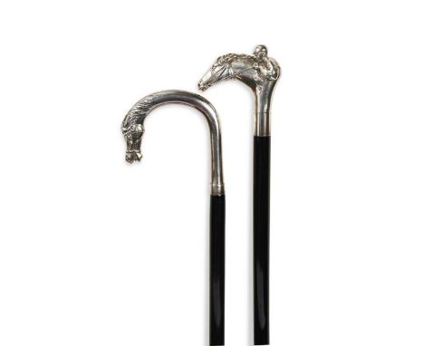 Of horse racing interest, two walking canes,  the first with white metal handle modelled as a horse and jockey, stamped 925, 