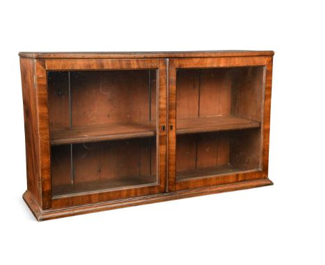 A George III Cuban mahogany cabinet, early 19th century, with a pair of glazed doors and single shelf within54 x 95 x 28cmOri