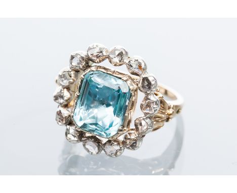 VICTORIAN AQUAMARINE AND DIAMOND CLUSTER RING
with a central step cut aquamarine measuring 9.5 x 7.6mm, surrounded by rose cu