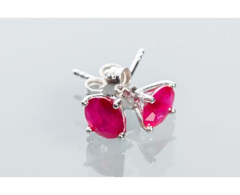 PAIR OF RUBY STUD EARRINGS
the oval cut rubies totalling approximately 2.42 carats, in eighteen carat white gold
