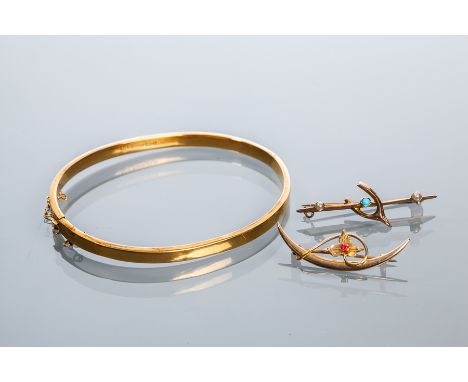 NINE CARAT GOLD BANGLE
hallmarked nine carat gold, 11.6g; together with two gold bar brooches, 6.4g gross (3)