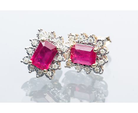 PAIR OF RUBY AND DIAMOND CLUSTER EARRINGS
each set with an emerald cut sapphire measuring approximately 7.17 x 5.24mm, each s