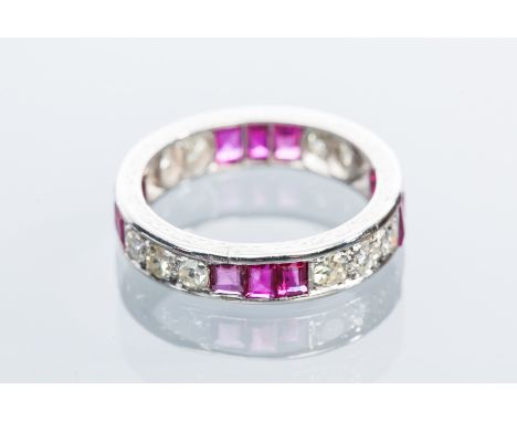 RUBY AND DIAMOND FULL ETERNITY RING
with brilliant cut diamonds totalling approximately 1 carat, separated by emerald cut rub