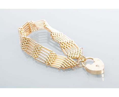 FINE EIGHTEEN CARAT GOLD GATE LINK BRACELET
with a heart shaped clasp, the clasp marked 18K for eighteen carat gold, 50.3g