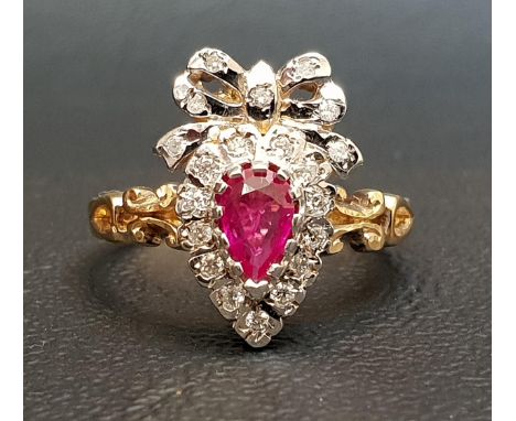 UNUSUAL RUBY AND DIAMOND CLUSTER RINGthe pear cut ruby in diamond surround and surmounted by a diamond set bow, on eighteen c