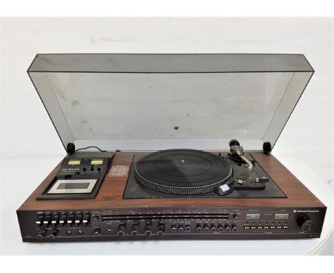NATIONAL PANASONIC MUSIC CENTREwith a smoked plastic lift up lid revealing a record player, cassette player and tuner, in a t