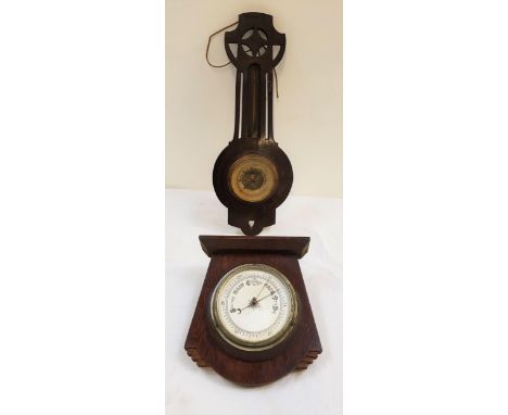 ART DECO ANEROID BAROMETERin a stepped shaped oak frame centred with a silvered dial, 24cm high, together with a mahogany bar