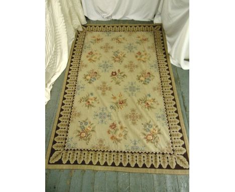 A rectangular hand stitched needlepoint carpet decorated with flowers and leaves, 276 x 176cm