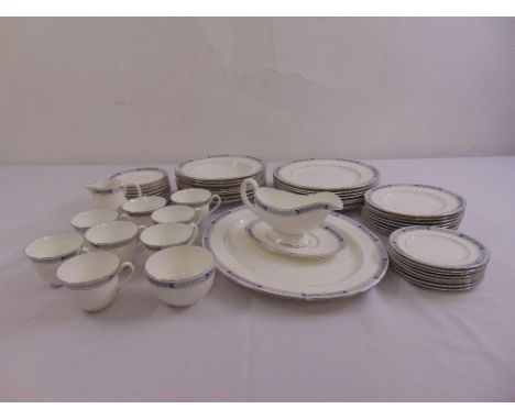A Royal Worcester Beaufort part dinner service to include plates, a sauce boat on stand, cups, saucers and a serving dish
