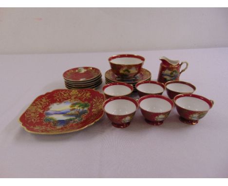 A Vienna style tea set decorated with gold flowers, to include cups, saucers, a milk jug and a plate (21)