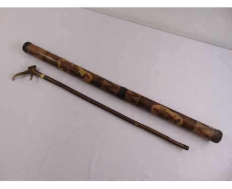 An Aboriginal didgeridoo and a walking stick with horn handle